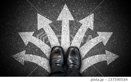Black business shoes and many chalky arrows on asphalt - decision concept 137590584