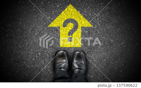 Black business shoes, yellow forward arrow and and question mark - problem concept Black business shoes, yellow forward arrow and and question mark - problem concept 137590622