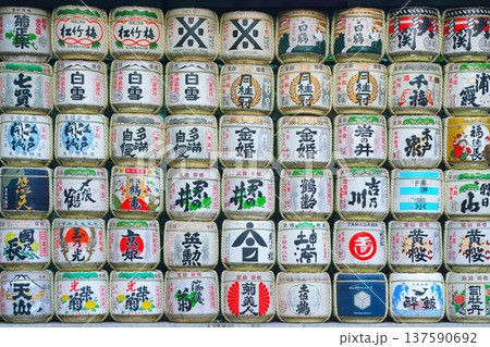Tokyo, Japan - Oct 15 2024, panoramic view of the many barrels of sake called kazaridaru decorated with various patterns and inscriptions on the territory of the Meiji Temple, Tokyo, Japan Tokyo, Japan - Oct 15 2024, panoramic view of the many barrels of sake called kazaridaru decorated with various patterns and inscriptions on the territory of the Meiji Temple, Tokyo, Japan 137590692