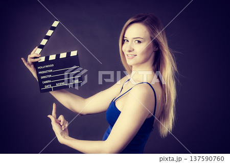 Woman holding professional film slate Woman holding professional film slate 137590760