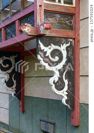 Sakata, Yamagata, japan - Oct 5 2024, Vertical view of a carved wooden window sill in Japanese style with a floral pattern, Sakata, Japan 137591024