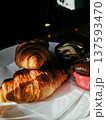 Fresh croissants served with chocolate 137593470