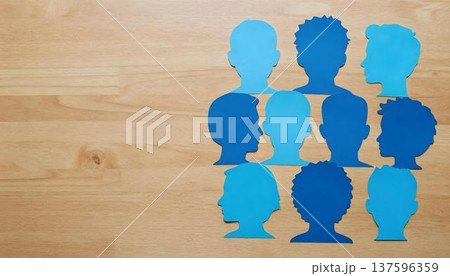 A group of blue paper cutouts representing people, highlighting Tar Syndrome Awareness Month with a ribbon background 137596359