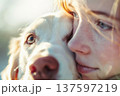 Teenager embraces dog. Eternal bond, cherished moments. 137597219