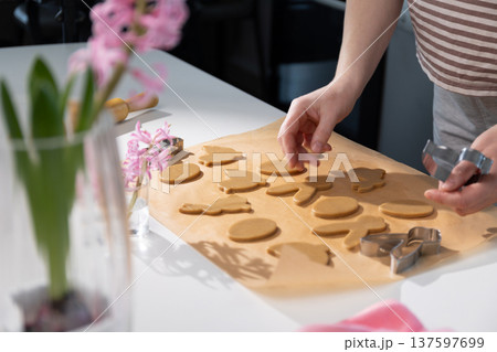 Creating Gingerbread Cookies for Easter Celebration With Family and Friends in the Kitchen 137597699