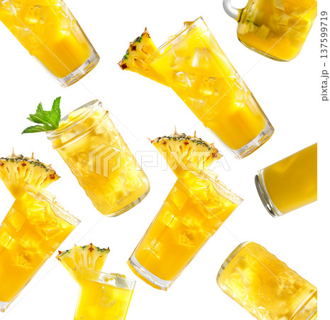 Multiple glasses of pineapple juice with ice isolated on white background, showing refreshing drink concept Multiple glasses of pineapple juice with ice isolated on white background, showing refreshing drink concept 137599719