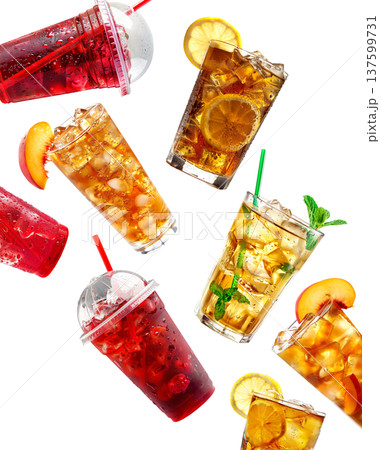 Iced fruit tea and berry drinks in cups and glasses isolated on white background, concept of refreshing beverages 137599731