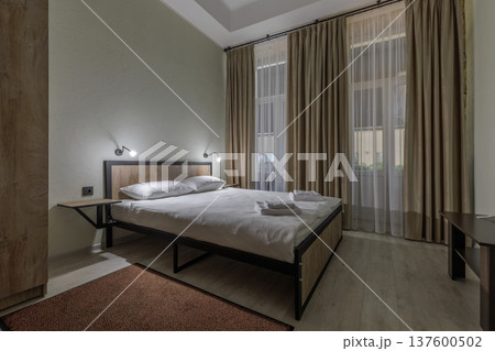 Double Bed in Modern Minimalist Hostel Room with City View 137600502