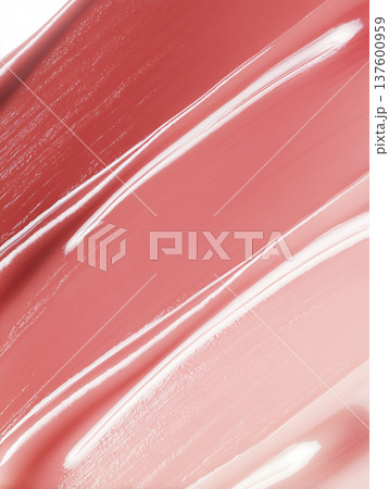 Glossy pink cosmetic smear shown in close macro style on a neutral backdrop, beauty product swatch and skincare concept Glossy pink cosmetic smear shown in close macro style on a neutral backdrop, beauty product swatch and skincare concept 137600959