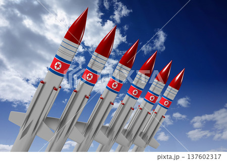 Missiles with North Korea flags and sky in background Missiles with North Korea flags and sky in background 137602317