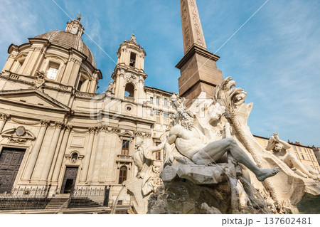 Fountain of the Four Rivers and Sant Agnese in Agone church at Piazza Navona in Rome Italy Fountain of the Four Rivers and Sant Agnese in Agone church at Piazza Navona in Rome Italy 137602481