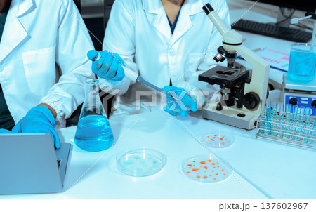 Chemist scientist or doctor working in research laboratory, medical analysis, documents, scientific study. 137602967
