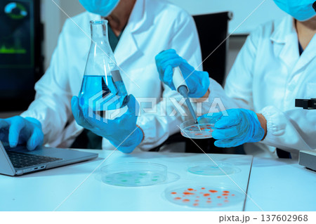Chemist scientist or doctor working in research laboratory, medical analysis, documents, scientific study. Chemist scientist or doctor working in research laboratory, medical analysis, documents, scientific study. 137602968