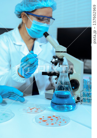 Chemist scientist or doctor working in research laboratory, medical analysis, documents, scientific study. 137602969