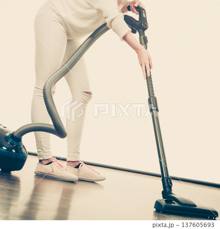 Woman legs and vacuum cleaner Woman legs and vacuum cleaner 137605693