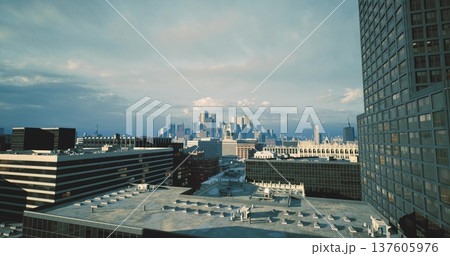 developmentfocused skyline with modern tower and construction hints, cranes in distance, dense blocks, marketready vibe and investment potential. 137605976