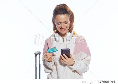 Modern Traveler Booking Flight on Smartphone with Credit Card 137606194