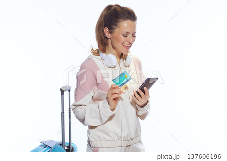 Woman Booking Travel with Smartphone and Credit Card 137606196