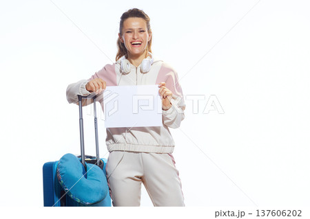 Smiling Female Traveler with Suitcase and Empty Sign 137606202