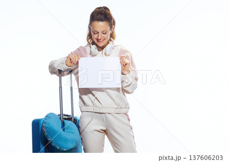 Joyful Traveler with Suitcase Holding Blank Placard 137606203