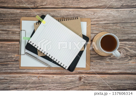 Minimalist workspace. Neat desk setup with coffee and stationery. Minimalist workspace. Neat desk setup with coffee and stationery. 137606314