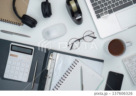 Workspace essentials. Organized desk with office supplies and technology. 137606326