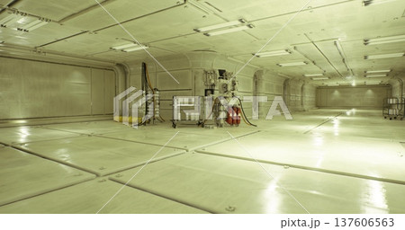 Service hub with processing modules and canisters, hoses connected to panels, floor reflection, bright sterile lighting, maintenance footprints, industrial 137606563