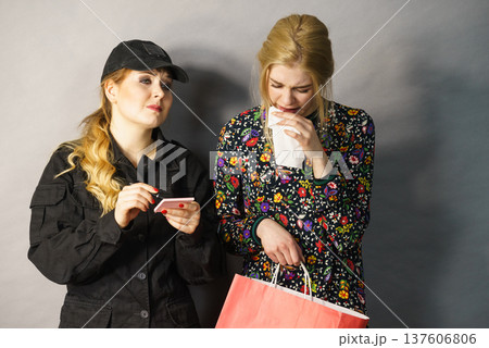 Security guard and shoplifter. 137606806