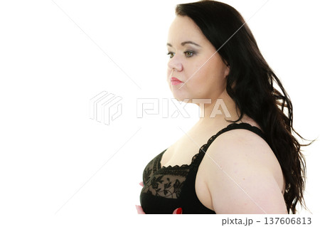 Woman in black bra showing her breast chest. 137606813