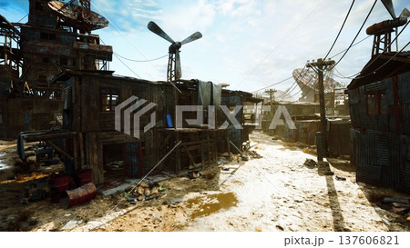 sunlit muddy alley in shantytown, windmill turning above makeshift shelters and telephone poles scavenger tracks, scattered scrap and puddles reflecting clear 137606821