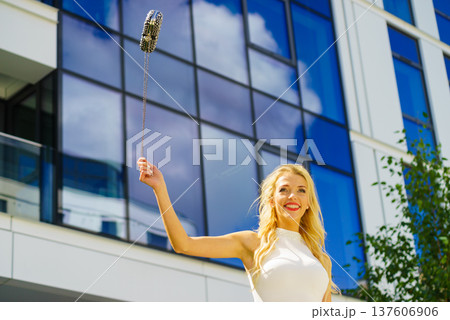 Cheerful fashionable woman in city Cheerful fashionable woman in city 137606906