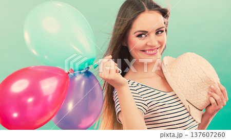 Happy girl playing with colorful balloons. Happy girl playing with colorful balloons. 137607260
