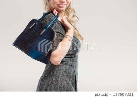 Chic woman with handbag. Chic woman with handbag. 137607321