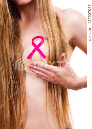 Woman chest in bra, pink cancer ribbon 137607687