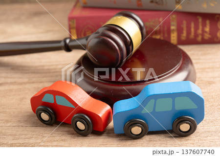 Car accident lawsuit and insurance, Judge hammer with car model. Car accident lawsuit and insurance, Judge hammer with car model. 137607740