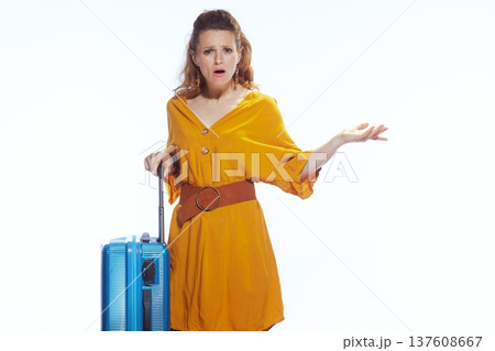 Shocked Woman with Suitcase Experiencing Travel Delays Shocked Woman with Suitcase Experiencing Travel Delays 137608667