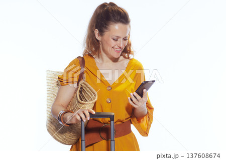 Modern Traveler Checking Trip Details on Smartphone 137608674