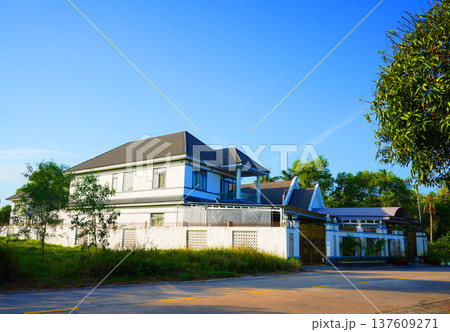 Villa at road in rural in Asia. Traditional house in Vietnam among wealthy population. Villa at road in rural in Asia. Traditional house in Vietnam among wealthy population. 137609271