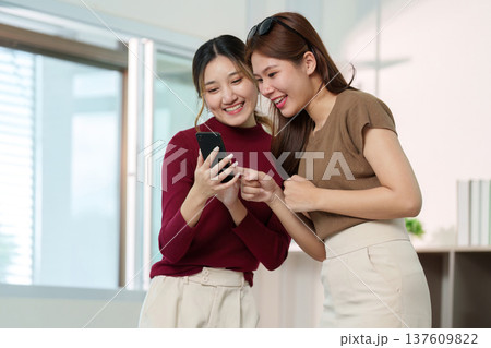 Social Media. Two friends sharing beauty tips while filming a skincare tutorial. Social Media. Two friends sharing beauty tips while filming a skincare tutorial. 137609822