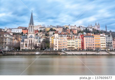 Lyon, france. December 29, 2023. Lyon cityscape with colorful hillside buildings, saint george church and basilica of notre dame de fourviere overlooking the saone river 137609877