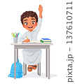 Happy young Arab elementary school boy sits at his desk raising his hand. Cartoon vector illustration. 137610711