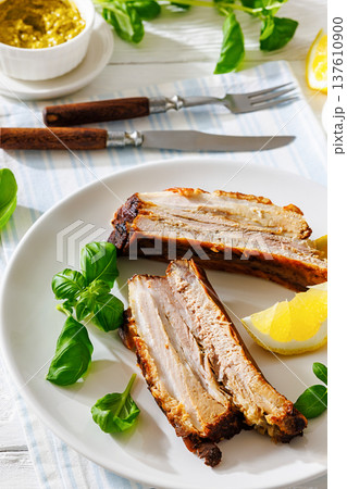 Roasted pork belly ribs with pesto and lemon Roasted pork belly ribs with pesto and lemon 137610900