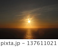 Golden Sunset Over the Atlantic Ocean with Sunstar Flare and Calm Water 137611021