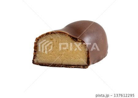Detailed confectionery macro showing chocolate coating and marzipan interior texture Detailed confectionery macro showing chocolate coating and marzipan interior texture 137612295