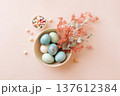 Pastel Easter eggs arranged in ceramic bowl with dried flowers on soft background, elegant spring flat lay composition for seasonal decoration and holiday blog design 137612384