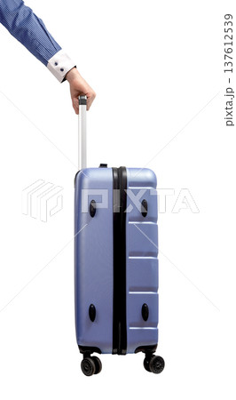 business hand holding suitcase. Side view of businessman pulling hardshell luggage with telescopic 137612539