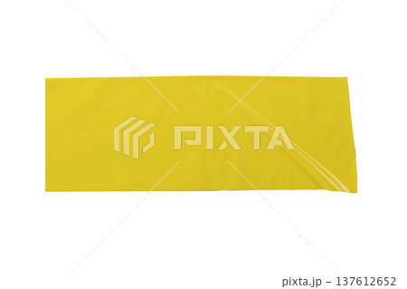 Wide yellow adhesive tape strip isolated on white background. Smooth glossy surface with slight fold Wide yellow adhesive tape strip isolated on white background. Smooth glossy surface with slight fold 137612652