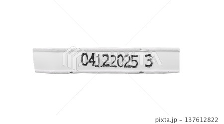 identification label strip with printed black serial code isolated on white background. Narrow identification label strip with printed black serial code isolated on white background. Narrow 137612822