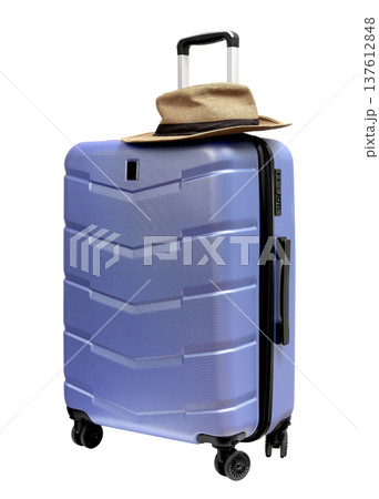 Wheeled suitcase, baggage with summer hat on top. Brimmed sunhat on large hardshell carry on luggage Wheeled suitcase, baggage with summer hat on top. Brimmed sunhat on large hardshell carry on luggage 137612848