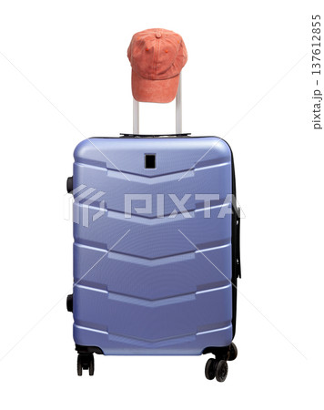 suitcase with pink baseball cap on top. Polycarbonate hard shell carry on luggage for summer suitcase with pink baseball cap on top. Polycarbonate hard shell carry on luggage for summer 137612855